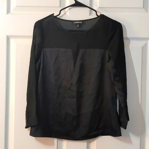 Cute black dressy blouse with some see through fabric.